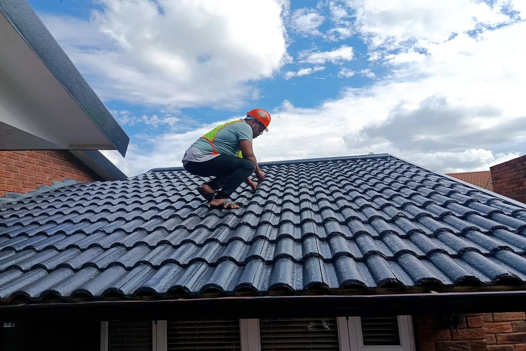 Imvelo roofer carrying out work on a tiled residential roof
